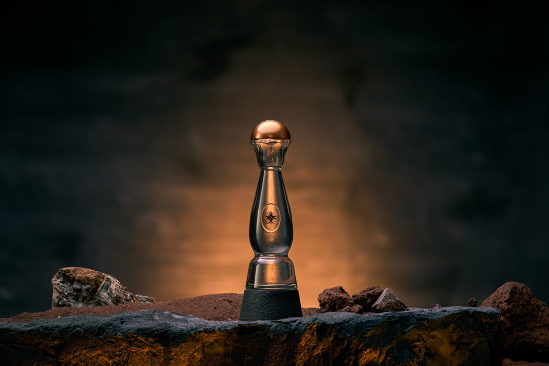 Clase Azul Ahumado Blanco bottle on table with warm lighting