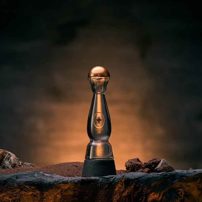 Clase Azul Ahumado Blanco bottle on table with warm lighting