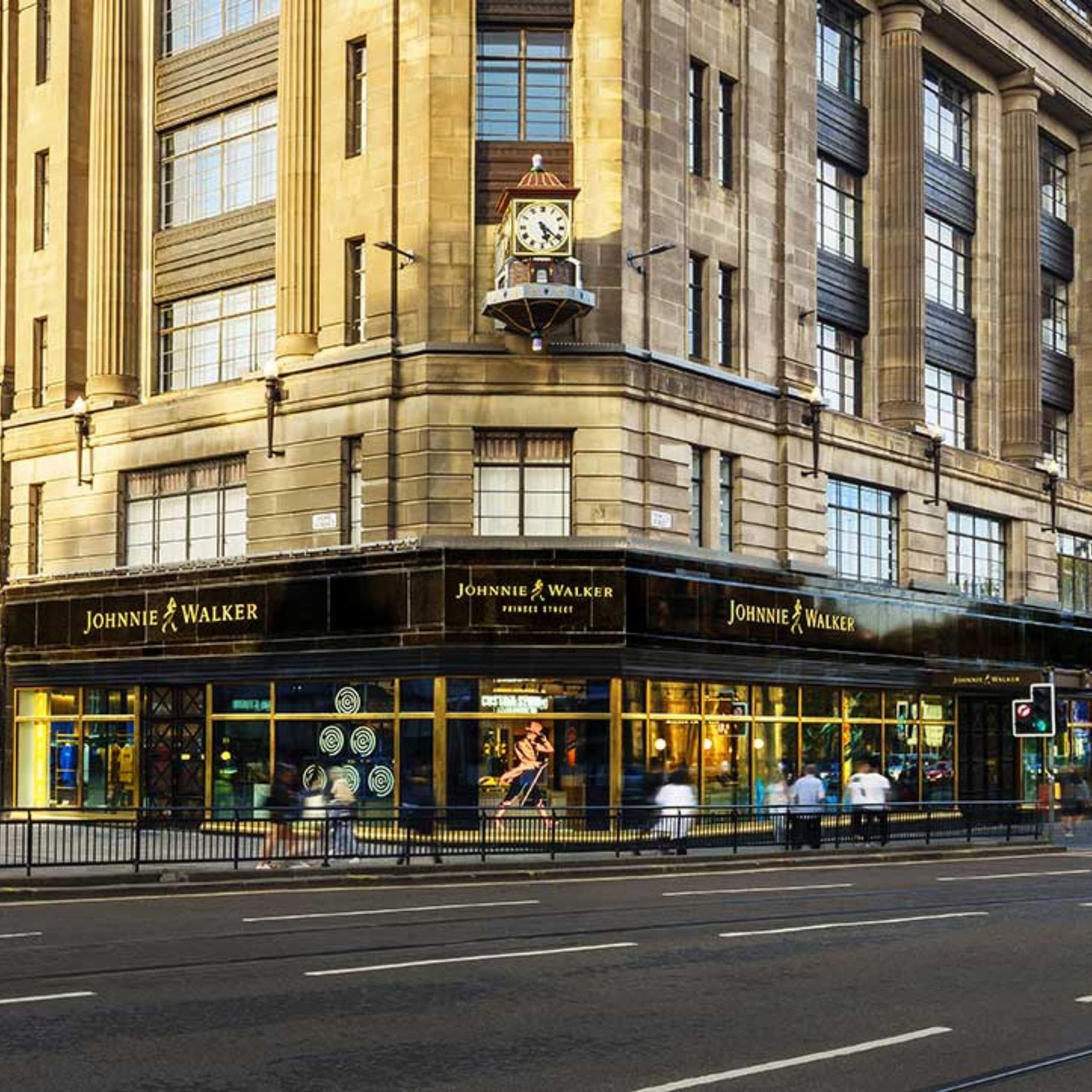 By 1908, with the help of illustrator Tom Browne, the Striding Man became the brand's symbol, leading to the creation of Johnnie Walker Red Label and Black Label. By 1920, Johnnie Walker whisky was available in 120 countries, becoming a global cultural icon, celebrated by statesmen, socialites, and artists alike. In 1934, the brand received a Royal Warrant from King George V. Today, Johnnie Walker is the world's largest Scotch whisky brand, embodying a spirit of progress and optimism.  - Kent Street Cellars